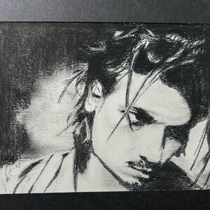 Charcoal Sketch portrait of young Johnny Depp.